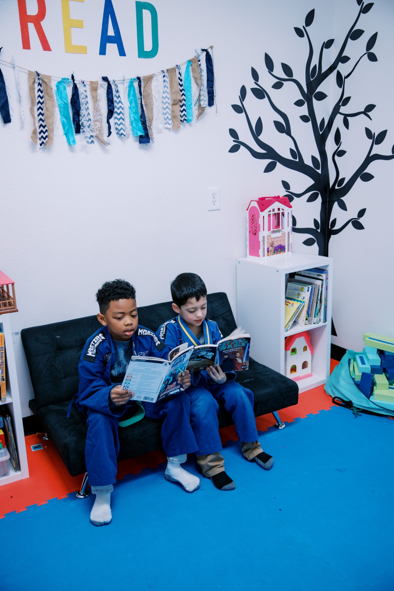 Students reading together in the academy's learning corner